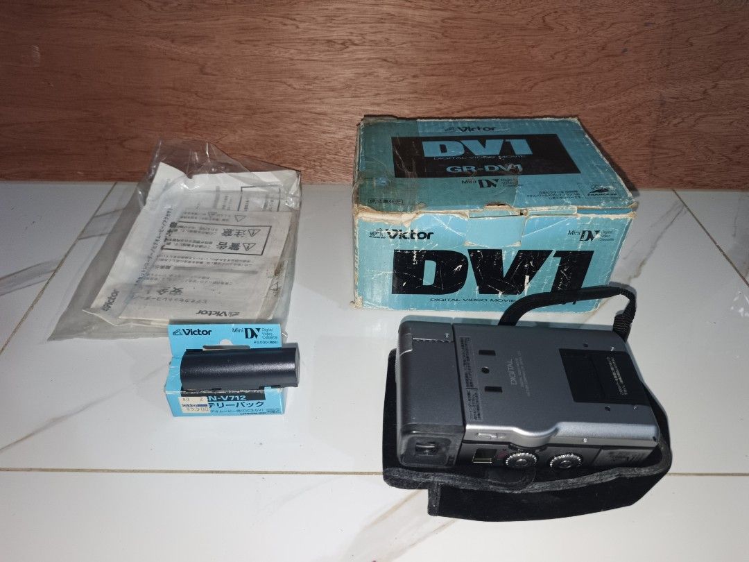 Victor GR-DV1 Mini DV Digital Video Camera with Battery (Category: Video Cameras) located in Binangonan. Submitted by kurama04 (Listing ID 1444011983, Image 1). Description: as is condition untested view finder goods lens good 💯 with battery with papers and leather pouch nd q alm panu iccharge i also i dont know to use it as is as is!.