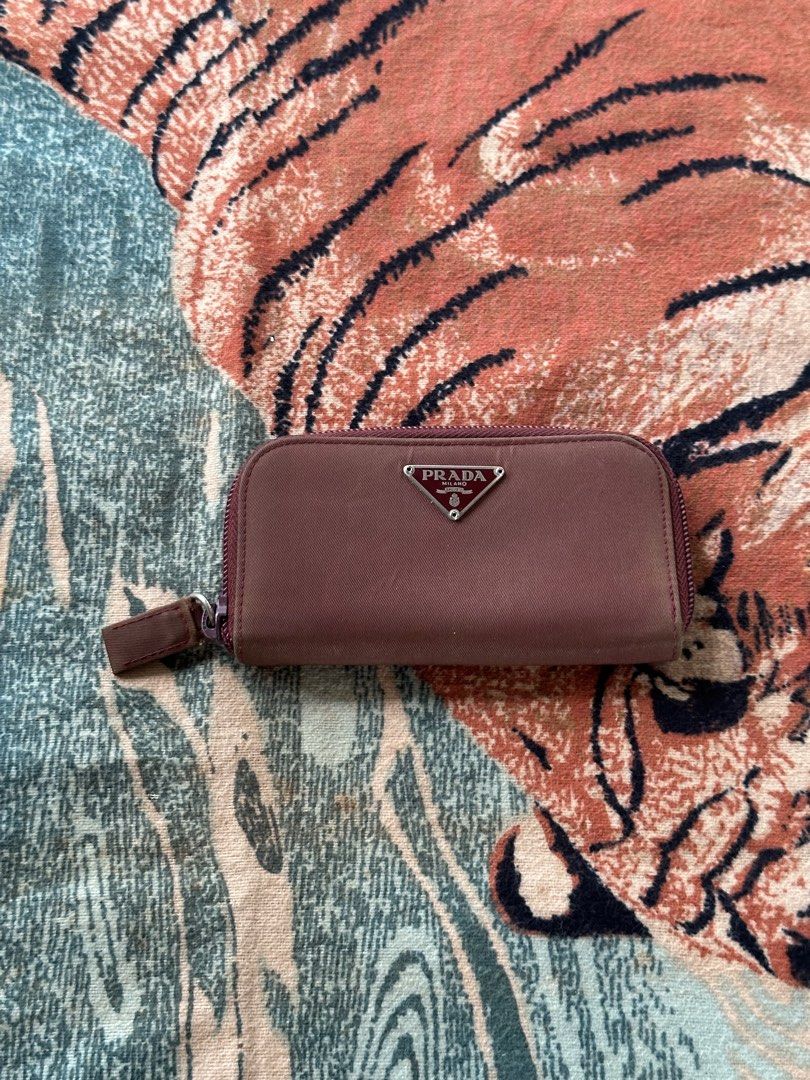 Vintage Prada card and keyholder (Category: Luxury Bags & Wallets) located in Los Banos. Submitted by streetwear.collections (Listing ID 1444075211, Image 1). Description: Vintage Prada card and keyholder Opti zipper Very good condition Fading Php 3,000 Thanks! .