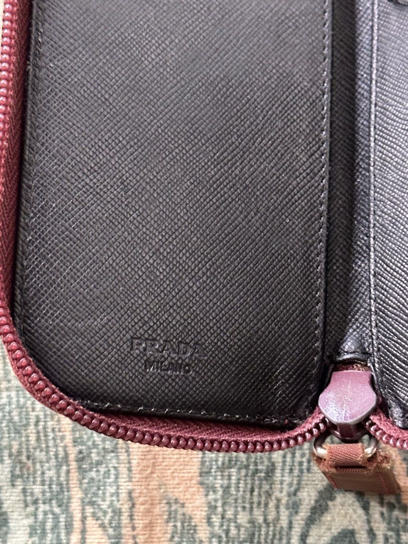 Vintage Prada card and keyholder (Category: Luxury Bags & Wallets) located in Los Banos. Submitted by streetwear.collections (Listing ID 1444075211, Image 3). Description: Vintage Prada card and keyholder Opti zipper Very good condition Fading Php 3,000 Thanks! .