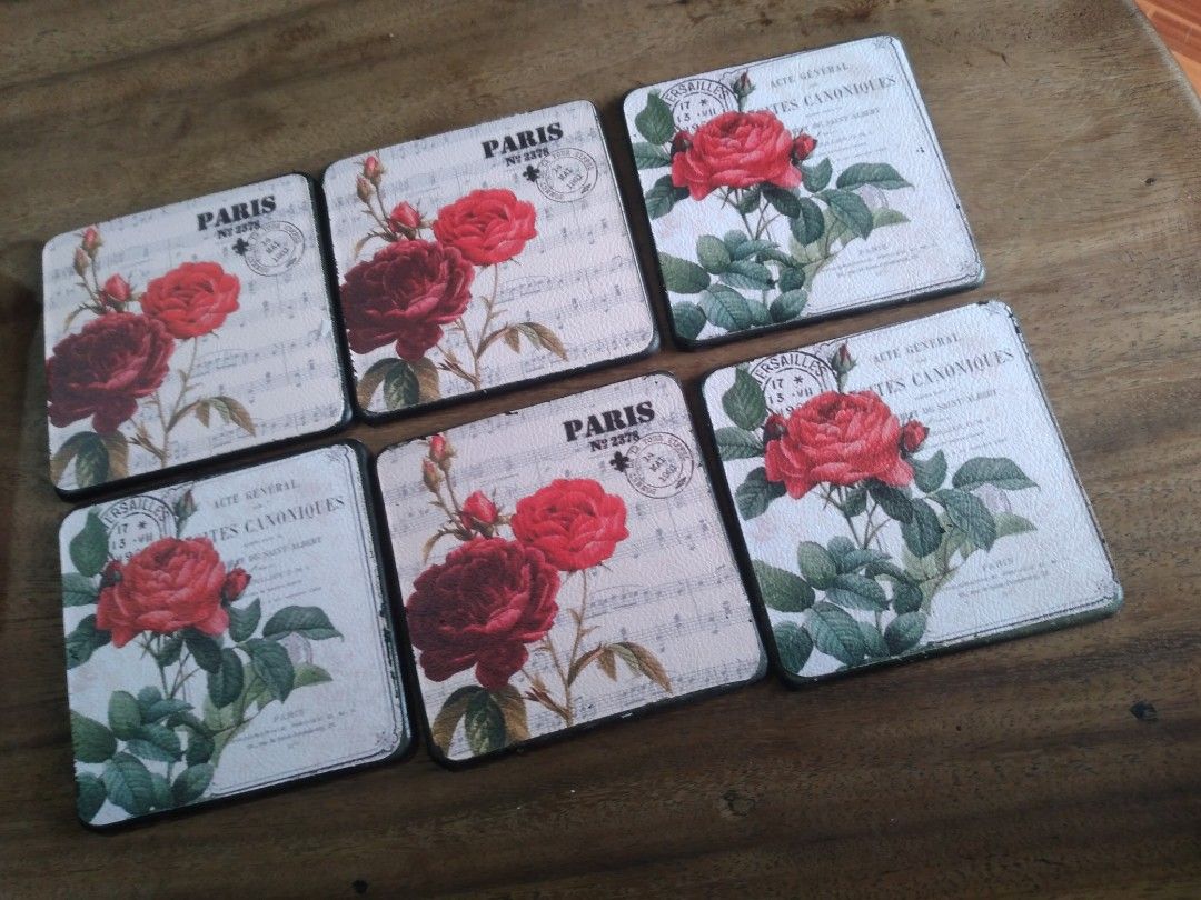 Vintage Rose Coasters Set with Box (Category: Other Kitchenware & Tableware) located in Pasig City. Submitted by aecollection03 (Listing ID 1443911867, Image 2). Description: -unused -Some paint chips on wood case from storage shown on pic 7 - Set of 6 coasters - Features a vintage rose design with French text - Comes with a black storage box - Ideal for protecting table surfaces - Adds a decorative touch to any setting - Perfect for tea parties 