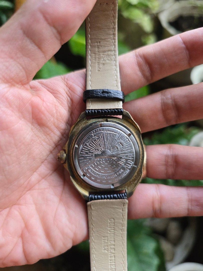 Vostok Komandirskie watch (Category: Women's Watches) located in Manila. Submitted by timearcph (Listing ID 1443975374, Image 3). Description: This Vostok Komandirskie watch features a unique dial depicting a Soviet strategic bomber aircraft.Brand: VostokModel: Komandirskie ("Commander")Features: Includes a calendar function and a mechanical manual-winding movement.Design: The dial showcases a red and blue aircraft silhouette over a blue grid pat