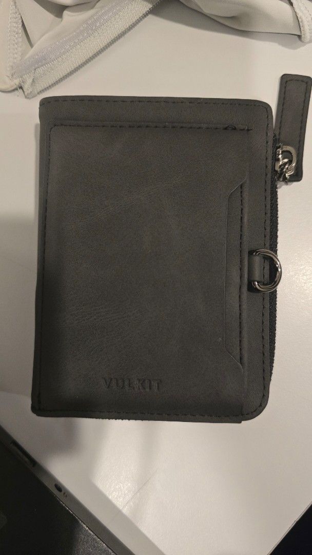 Vulkit Bi-fold Zipper Wallet (Category: Luxury Bags & Wallets) located in Manila. Submitted by rm_032 (Listing ID 1443999377, Image 1). Description: Model: VULKIT-Minimalist RFID Blocking Leather Zippered Bifold Wallet with Coin Pocket-VW117 - RFID blocking - black bi-fold wallet - Zipper closure around the outside - Multiple card slots inside - Zippered coin pocket - Clear ID window.