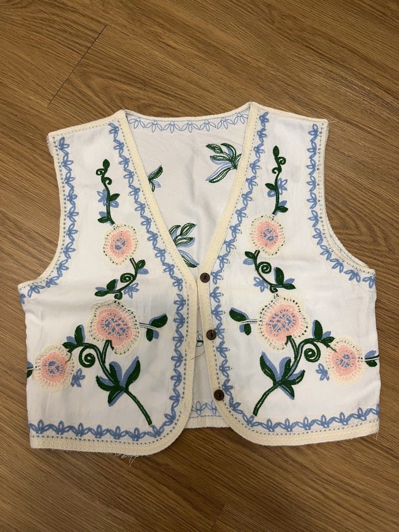 White Embroidered Floral Vest (Category: Sleeveless) located in Quezon City. Submitted by greentea1209 (Listing ID 1444103164, Image 1). Description: - White vest with floral embroidery - Used only once.