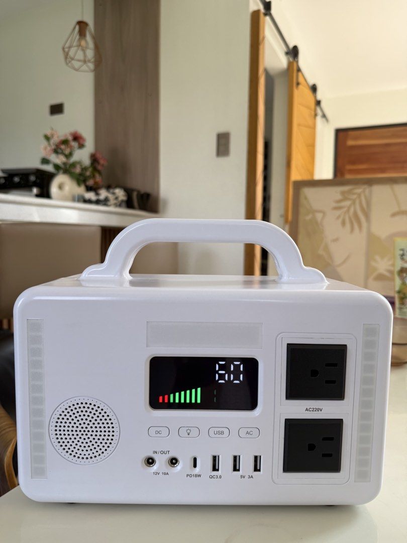 White Portable Power Station with Multiple Outlets & USB Ports (Category: Other Gadgets) located in Santa Rosa. Submitted by zyzy008 (Listing ID 1443967771, Image 3). Description: - Versatile power: AC outlets, DC output, and USB ports (including Quick Charge 3.0) - Clear digital display: Shows battery level and output status - Built-in entertainment: Speaker and side LED lights included - Portable design: Easy-to-carry handle for on-the-go use -