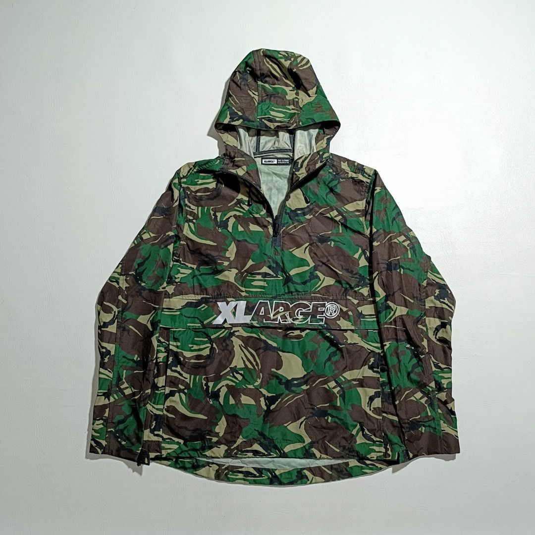 Xlarge Camouflage Windbreaker (Category: Activewear) located in Baguio. Submitted by freshmarket_2600 (Listing ID 1444055903, Image 1). Description: Brand: Xlarge Reflectorize logo Windbreaker Kangaroo Pocket Tags: Complete Size: Med Dimension: L26W21 Condition: Excellent-Brandnew Color rate: 10/10 Color: camo Issue/s: Removed side chest patch.