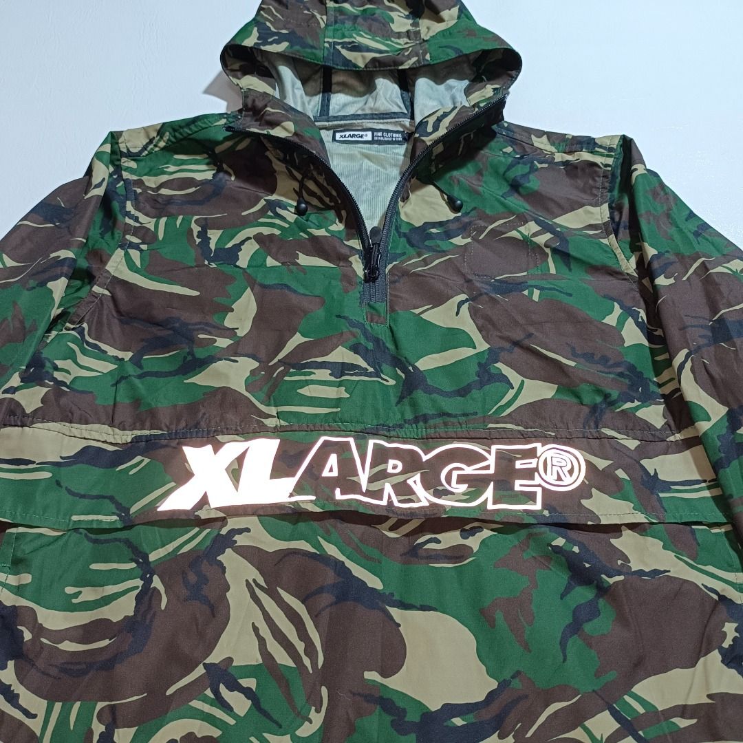 Xlarge Camouflage Windbreaker (Category: Activewear) located in Baguio. Submitted by freshmarket_2600 (Listing ID 1444055903, Image 2). Description: Brand: Xlarge Reflectorize logo Windbreaker Kangaroo Pocket Tags: Complete Size: Med Dimension: L26W21 Condition: Excellent-Brandnew Color rate: 10/10 Color: camo Issue/s: Removed side chest patch.