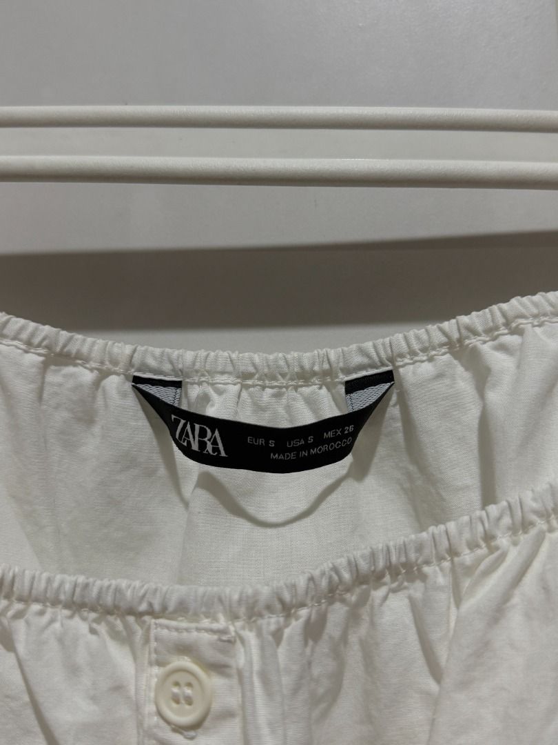 Zara White Square Neck Puff Sleeve Button Up Crop Top (Category: Blouses) located in Mandaluyong City. Submitted by kayechx (Listing ID 1444076342, Image 2). Description: - White Zara crop top - Square neckline - Short puff sleeves - Button-up front - Smocked elasticated back for a snug fit - Pairs well with high-waisted bottoms - Comfortable and stylish for casual wear can give 10% discount if you purchase 3 or more items from me.
