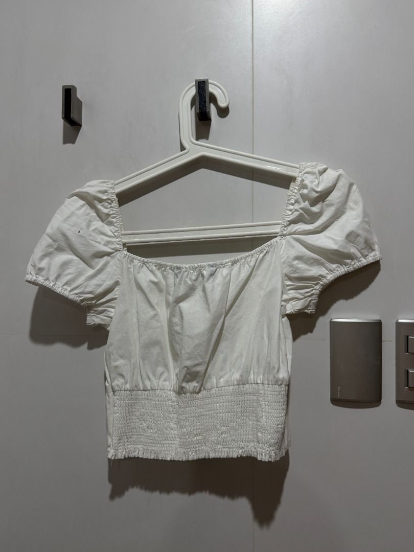 Zara White Square Neck Puff Sleeve Button Up Crop Top (Category: Blouses) located in Mandaluyong City. Submitted by kayechx (Listing ID 1444076342, Image 3). Description: - White Zara crop top - Square neckline - Short puff sleeves - Button-up front - Smocked elasticated back for a snug fit - Pairs well with high-waisted bottoms - Comfortable and stylish for casual wear can give 10% discount if you purchase 3 or more items from me.