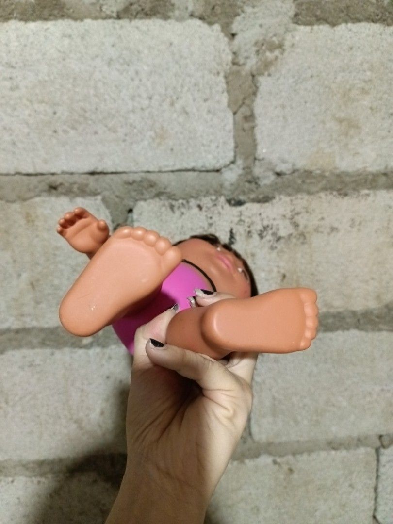 2003 Mattel Dora the Explorer Doll (Category: Kids Toys) located in Manila. Submitted by caaths_collection (Listing ID 1444173349, Image 3). Description: - Dora the Explorer doll from 2003 - Manufactured by Mattel - Features brown hair and brown eyes - Dressed in a cute black and pink swimsuit - Minor scuffs present on the feet - Ideal for Dora collectors or for playtime fun - preloved.