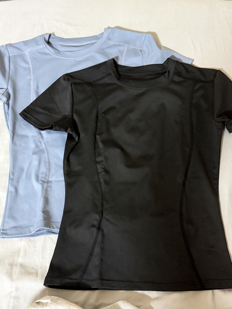 2x Athletic T-shirts - Black and Light Blue (Category: Activewear) located in Manila. Submitted by miapiee (Listing ID 1444256594, Image 1). Description: - Set of 2 athletic t-shirts (1 black, 1 light blue) - Short sleeves, crew neck - Sporty seam design - Smooth and stretchy material - Ideal for workouts or casual wear.