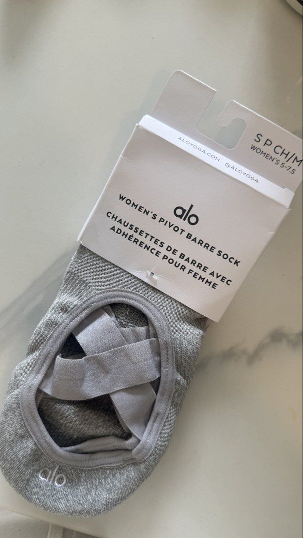 Alo Yoga Women's Pivot Barre Socks Grey Size S/CH/M (Category: Activewear) located in Singapore. Submitted by eyeletlove (Listing ID 1444151421, Image 3). Description: - Grey Alo Yoga barre socks - Designed for grip and support - Criss-cross strap for secure fit - Comfortable and breathable material - Ideal for barre, yoga, pilates - Size S/CH/M (fits women's US 5-7.5).