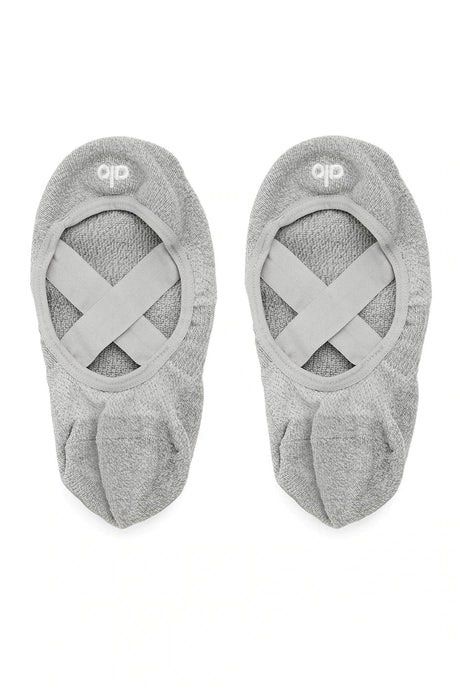 Alo Yoga Women's Pivot Barre Socks Grey Size S/CH/M (Category: Activewear) located in Singapore. Submitted by eyeletlove (Listing ID 1444151421, Image 1). Description: - Grey Alo Yoga barre socks - Designed for grip and support - Criss-cross strap for secure fit - Comfortable and breathable material - Ideal for barre, yoga, pilates - Size S/CH/M (fits women's US 5-7.5).