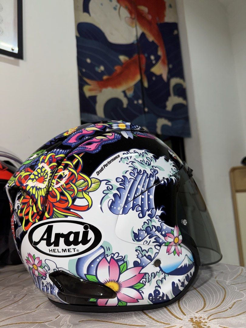 Arai VZ-Ram Tattoo Series Helmet (Category: Motorcycle Apparel) located in Singapore. Submitted by n.nabila25 (Listing ID 1444232245, Image 2). Description: - Arai VZ-Ram Helmet - Unique Japanese tattoo design (koi fish & waves) - Clear visor included - Stylish and functional for riders - Stand out on your rides! - Size M (Used 4 times only!) - Selling @ 750 , Able to nego! offer me your best price, but no lowball!.