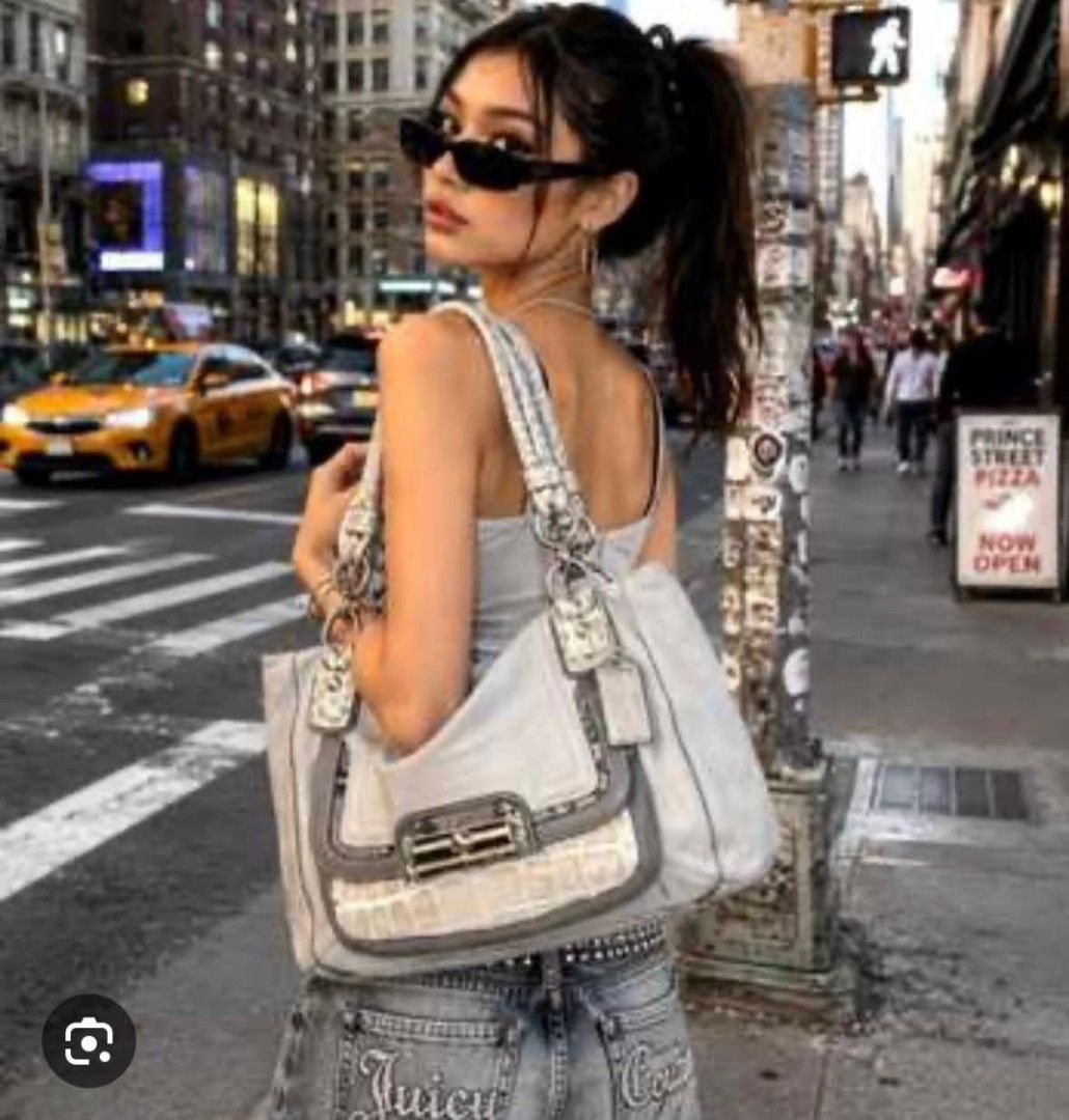 Authentic Coach Leather & Exotic Trim Shoulder Bag (Category: Luxury Bags & Wallets) located in Marikina City. Submitted by aussiemaan (Listing ID 1444302942, Image 2). Description: - Light grey Coach shoulder bag - Genuine leather with textured trim details - Convenient front flap pocket - Comfortable top handles - Sleek silver hardware - Medium size, ideal for everyday essentials - Versatile for daily use.