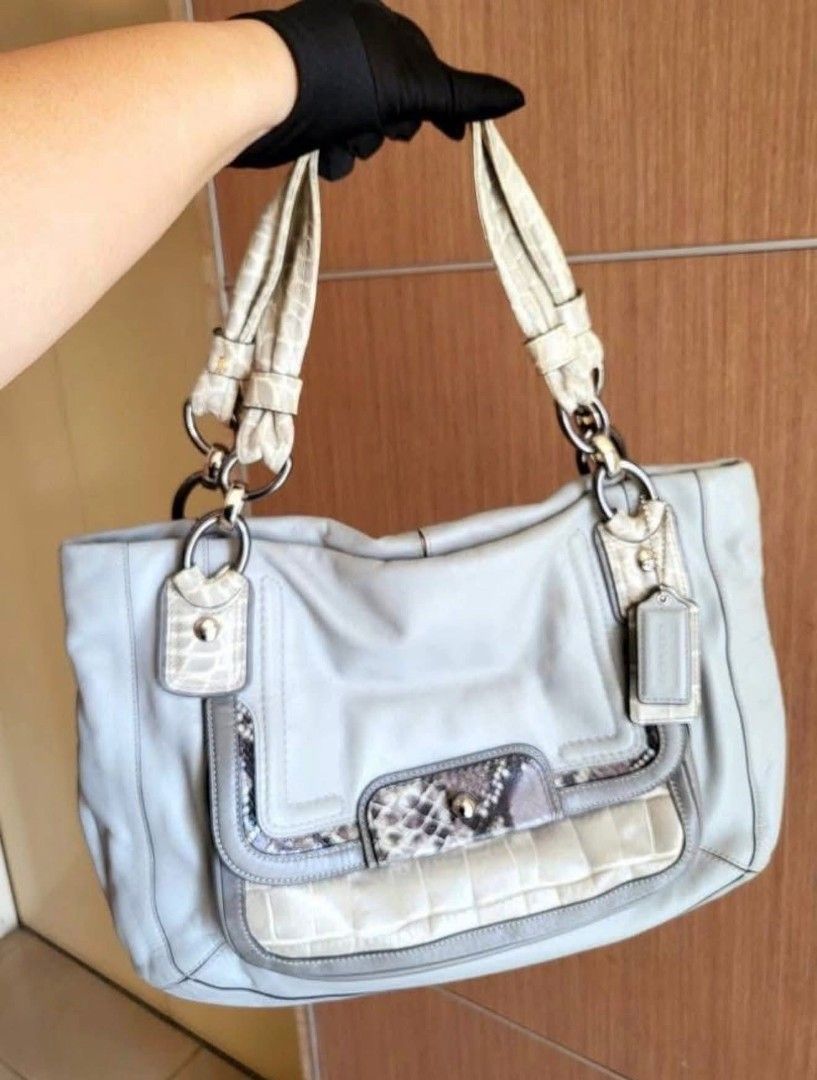 Authentic Coach Leather & Exotic Trim Shoulder Bag (Category: Luxury Bags & Wallets) located in Marikina City. Submitted by aussiemaan (Listing ID 1444302942, Image 1). Description: - Light grey Coach shoulder bag - Genuine leather with textured trim details - Convenient front flap pocket - Comfortable top handles - Sleek silver hardware - Medium size, ideal for everyday essentials - Versatile for daily use.