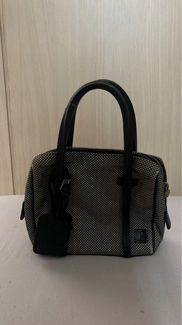 Bally Black and White Patterned Handbag with Leather Handles (Category: Luxury Bags & Wallets) located in Quezon City. Submitted by rafdeclutter (Listing ID 1444199264, Image 1). Description: - Cute black and white patterned handbag - Black leather handles - Secure zipper closure - Small and compact, ideal for essentials.