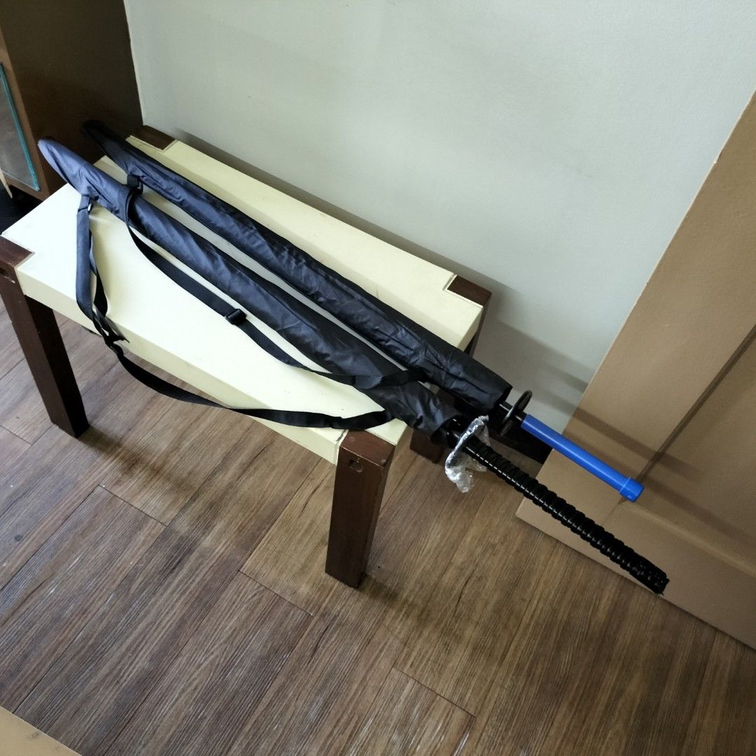 2pc Big and Long Umbrellas with defect (Category: Umbrellas) located in Paranaque City. Submitted by decluttering-all (Listing ID 1444182008, Image 1). Description: - black samurai sword design umbrella with broken handle - blue handle umbrella with detached divider between handle and button - Durable black fabric - Comes with a black carrying sleeve and strap - minor damage - Ideal for rainy days or as a unique prop 65 per PC 100 if you get the 