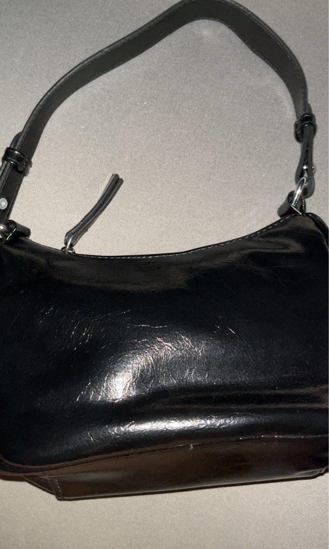 Black Patent Leather Shoulder Bag with Silver Hardware (Category: Shoulder Bags) located in Cavite. Submitted by Elyseen (Listing ID 1444300799, Image 2). Description: - Shiny black leather shoulder bag - Adjustable strap and free long strap - Barely used it .