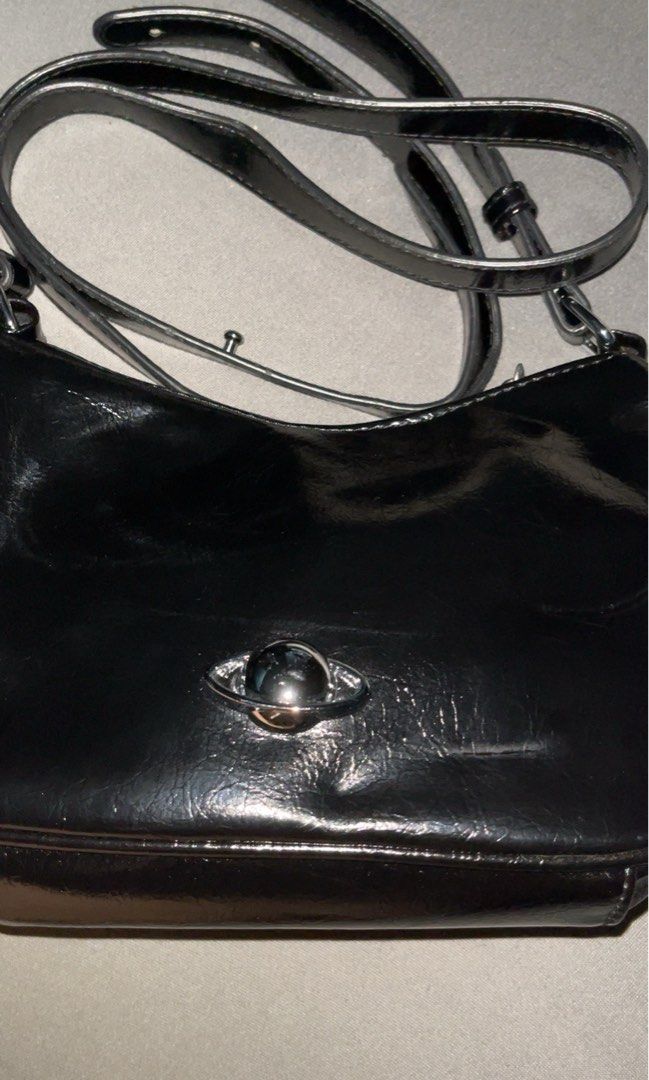 Black Patent Leather Shoulder Bag with Silver Hardware (Category: Shoulder Bags) located in Cavite. Submitted by Elyseen (Listing ID 1444300799, Image 1). Description: - Shiny black leather shoulder bag - Adjustable strap and free long strap - Barely used it .