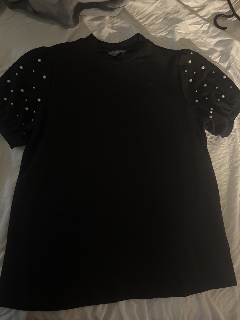 Black Pearl Embellished Puff Sleeve Top (Category: Blouses) located in General Trias. Submitted by misousoup (Listing ID 1444285589, Image 1). Description: - stylish puff sleeves with pearl embellishments - Chic mock neck design - Fits Large - RFS: Decluttering.