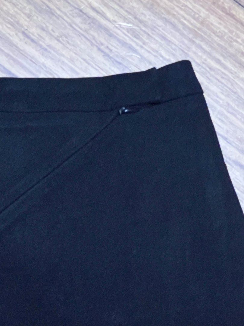 Black pencil skirt with diagonal zipper (Category: Skirts) located in Pasig City. Submitted by tiny_studios (Listing ID 1444202430, Image 2). Description: mom’s old work clothes - mango women’s - Size M - no damages - vintage look - get 3 items below 200, get cheapest one for free.