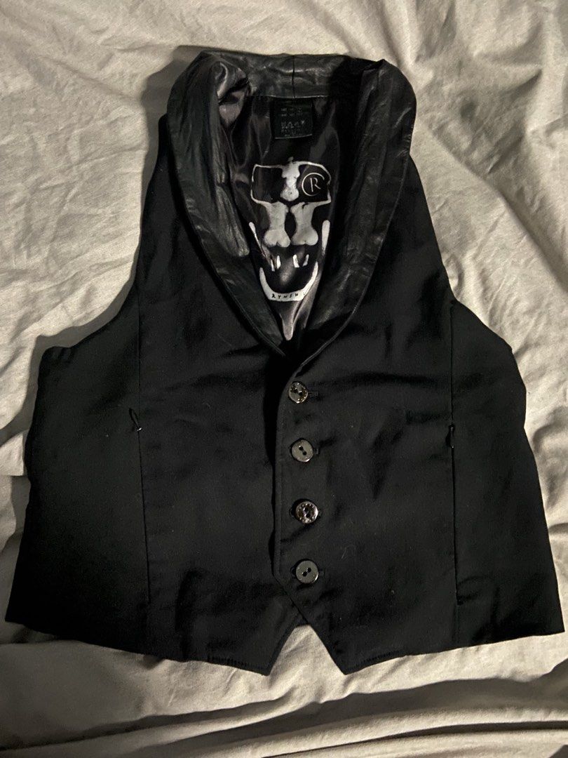 Black Shawl Collar Vest with Skull Lining (Category: Others Tops) located in Manila. Submitted by nhclknt (Listing ID 1444224285, Image 1). Description: - Black vest with a stylish shawl collar. - Features a cool skull graphic lining. - Button-up front closure. - Convenient side pockets. - Ideal for layering or as a standalone statement piece..