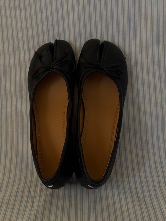 black tabi heels with bow detail (Category: Flats & Sandals) located in San Antonio. Submitted by lostnfoundph (Listing ID 1443996688, Image 3). Description: - Classic black leather tabi flats - Features a charming small bow on the toe - Comfortable low block heel for all-day wear - Easy slip-on style for convenience - A versatile staple for any fashion-forward wardrobe -Used once only.