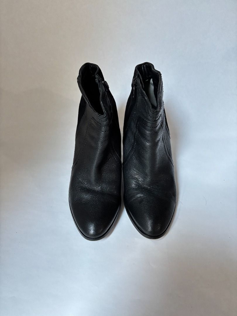Black Textured Ankle Boots with Zipper (Category: Boots) located in Taguig. Submitted by hokie6923 (Listing ID 1444250311, Image 2). Description: - Stylish black ankle boots - Textured finish with a slight shine - Convenient side zipper for easy wear - Elegant pointed toe design - Versatile for dressing up or down.