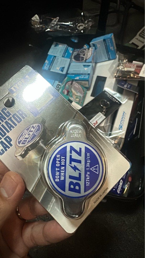 Blitz Radiator Cap - Made in Japan (Category: Caps & Hats) located in Manila. Submitted by kimberlyca31067 (Listing ID 1444136840, Image 1). Description: - Brand new Blitz radiator cap - Made in Japan - Color: Blue and Silver with Blitz branding - Features 'Don't Open When Hot' warning - Includes pressure ratings - Still in original packaging - Ideal for car enthusiasts.