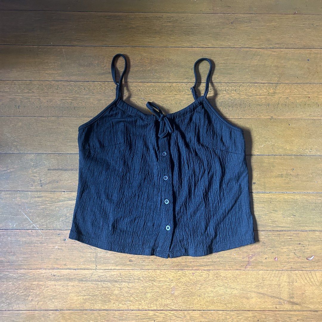 Brandy Melville black Tie Front Tank Top (Category: Sleeveless) located in Marikina City. Submitted by talugh (Listing ID 1439934788, Image 1). Description: color black free size can fit s-l tags : baby tee, fitted top, ribbed top, basic top, cropped top, stretch top, cotton top, casual top, everyday top, white top, black top, brown top, minimalist, clean girl aesthetic, pinterest outfit, pinterest fashion, brandy melville inspired, brandy style,