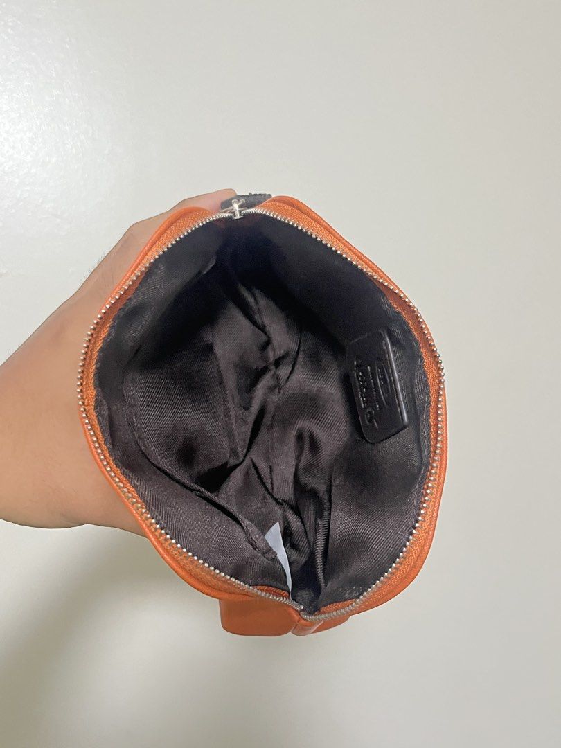 Brics orange pouch (Category: Purses & Pouches) located in Manila. Submitted by all.love.thrift.shop.v2 (Listing ID 1444121779, Image 2). Description: For sale! Brics pouch Excellent condition ₱299 + sf As is, No return No exchange No refund Color may vary due to lighting All items are cleaned before shipping Payment first via gcash/maya/gotyme/maribank bank transfer 💰 Ship via LBC/J&T/Lalamove 🚛 📍 Cainta, Rizal ❤️.