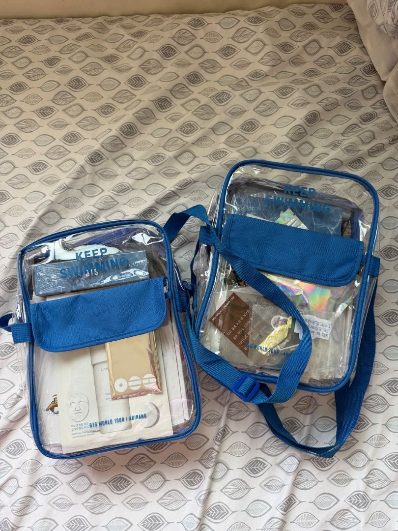 BTS IN BUSAN GIFT SET - DAY 1 - ONLY 1 SET AVAILABLE (Category: Cross-body Bags) located in Manila. Submitted by declutterbyj_ (Listing ID 1444181842, Image 1). Description: - Two clear sling bags available. Wave -Clear blag with ‘KEEP SWIMMING’ print -OT7 photocards -Postcard with messages from BTS -2 towels (in box) -2 solid perfumes -Light blue umbrella with floater print -Laneige mask RFS: extra from D1 Busan (attended 2 days concert) Origin 