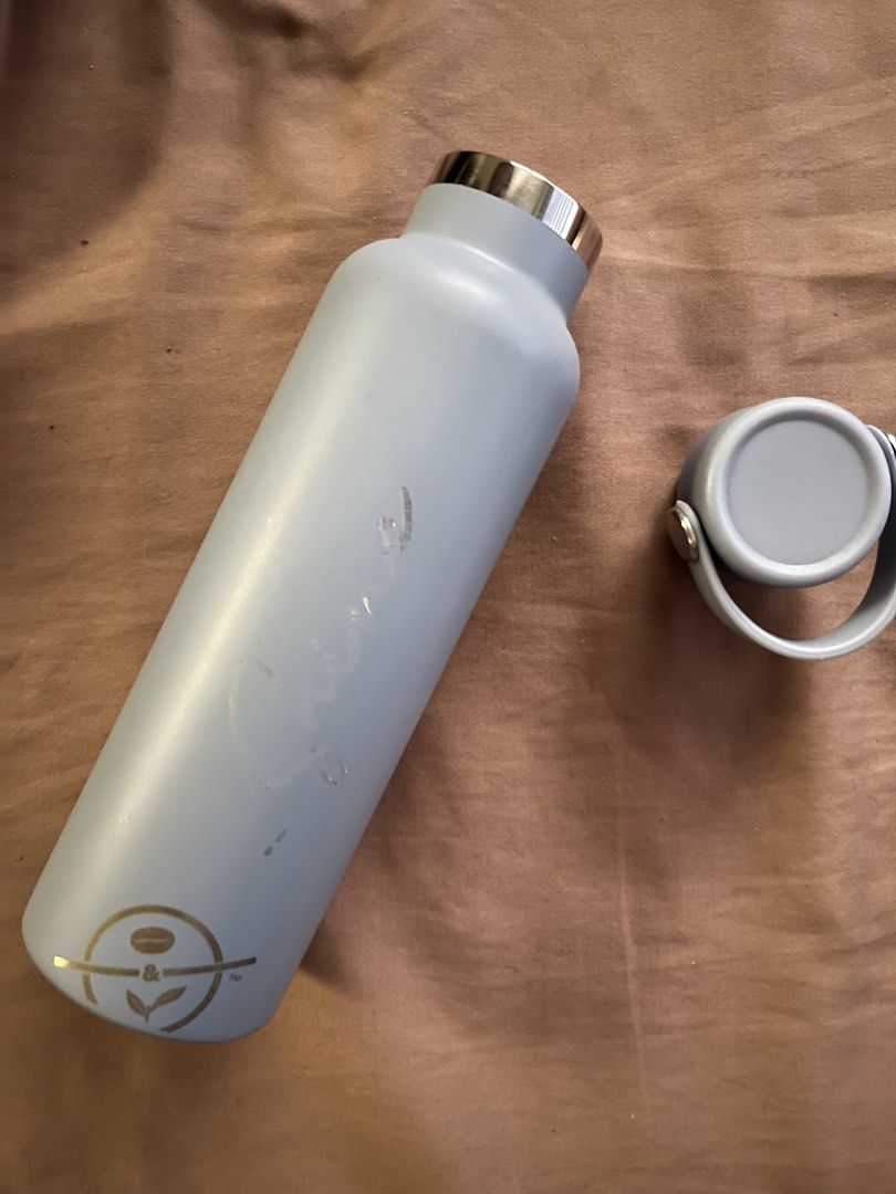 CBTL Stainless Water Bottle (Category: Water Bottles & Tumblers) located in Manila. Submitted by subz013 (Listing ID 1444190358, Image 2). Description: - Light blue insulated water bottle - Features a coffee bean logo at the bottom - Grey lid with a silver ring - Excellent for maintaining drink temperature (hot or cold).