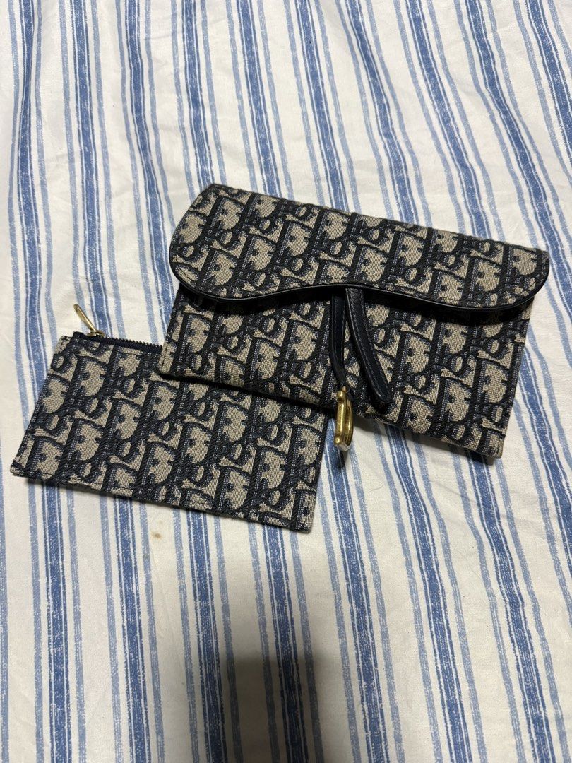 Christian Dior Saddle Pouch and Wallet Set (Category: Luxury Bags & Wallets) located in Pateros City. Submitted by thedeclutteristph (Listing ID 1444175691, Image 1). Description: - Store bought Dior Saddle pouch with chain - complete set - Store price is P105k - Classic Dior Oblique canvas - Gold hardware details - Detachable chain strap included - Ideal for carrying essentials - Versatile for day or night use.