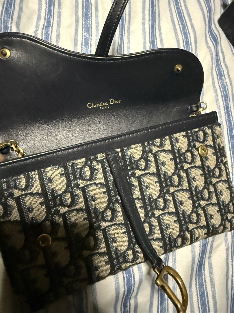 Christian Dior Saddle Pouch and Wallet Set (Category: Luxury Bags & Wallets) located in Pateros City. Submitted by thedeclutteristph (Listing ID 1444175691, Image 2). Description: - Store bought Dior Saddle pouch with chain - complete set - Store price is P105k - Classic Dior Oblique canvas - Gold hardware details - Detachable chain strap included - Ideal for carrying essentials - Versatile for day or night use.