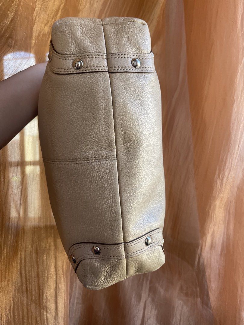 Coach Carly Hobo Shoulder Bag (Category: Luxury Bags & Wallets) located in Davao. Submitted by boodle4lyf (Listing ID 1444174090, Image 3). Description: Authentic light beige Coach hobo bag in soft pebbled leather. Features silver hardware and chain accents. Interior has minimal staining but other than that the bag is in very good condition with minimal signs of usage only. .