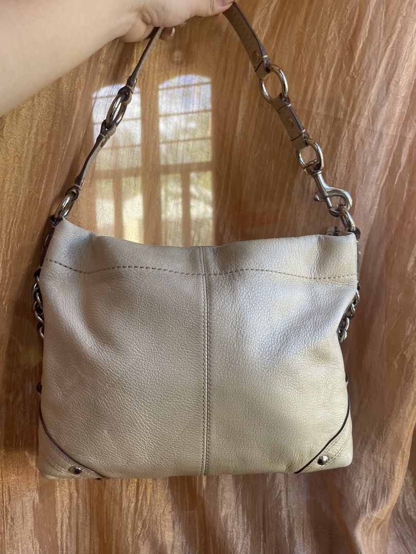 Coach Carly Hobo Shoulder Bag (Category: Luxury Bags & Wallets) located in Davao. Submitted by boodle4lyf (Listing ID 1444174090, Image 2). Description: Authentic light beige Coach hobo bag in soft pebbled leather. Features silver hardware and chain accents. Interior has minimal staining but other than that the bag is in very good condition with minimal signs of usage only. .