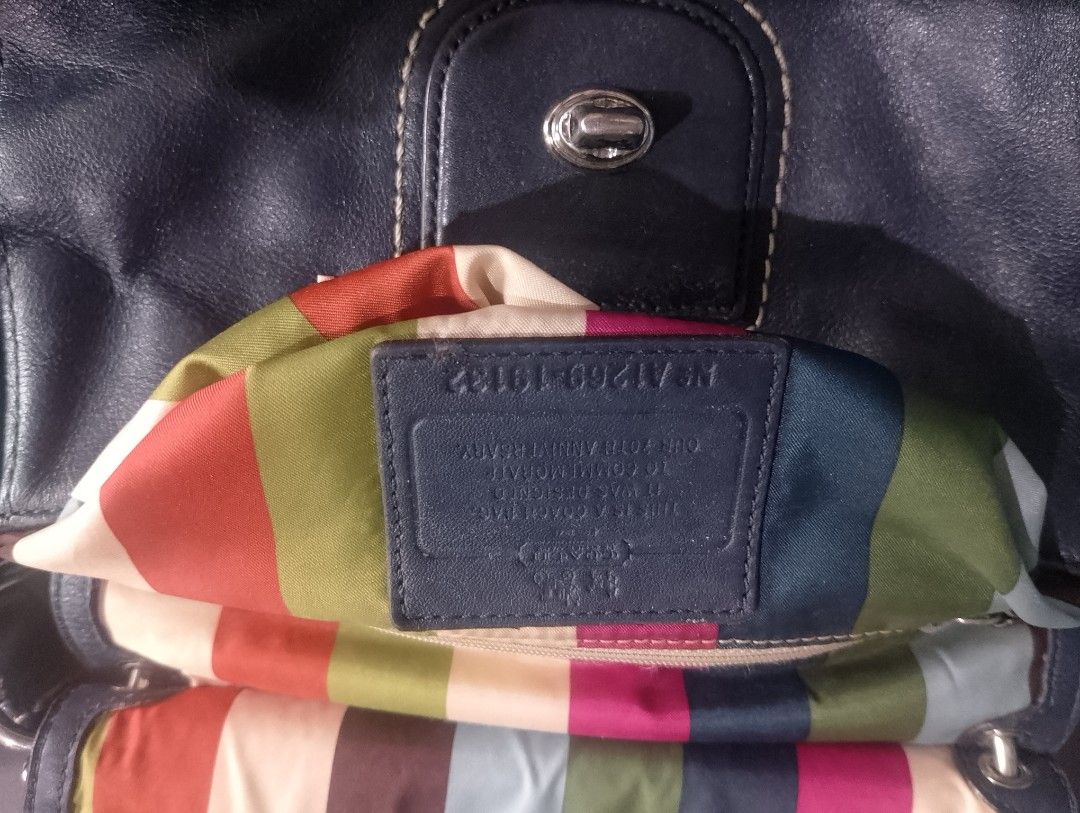 Coach Leather Handbag Navy Blue Limited Edition (Category: Luxury Bags & Wallets) located in Manila. Submitted by silenttiger-e0e3 (Listing ID 1444159227, Image 2). Description: - Authentic Navy Blue Coach Leather Handbag - Eye-catching Colorful Striped Interior Lining - Detachable Shoulder Strap Included - Stylish Tassel Detail - Signature Metal Coach Logo Charm - Interior Tag with Model Number for Authenticity.