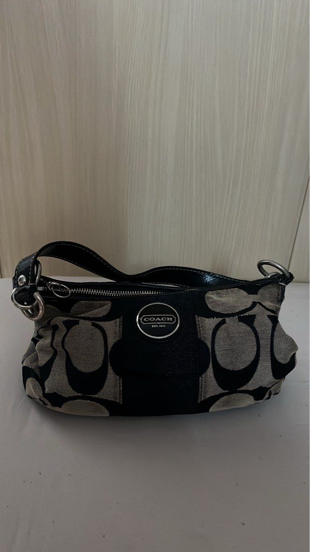 Coach Monogram Canvas Hobo Bag (Category: Luxury Bags & Wallets) located in Quezon City. Submitted by rafdeclutter (Listing ID 1444198166, Image 1). Description: - Classic vintage Coach hobo bag - Signature black and grey monogram print - Black leather trim and strap - Zipper closure - Silver hardware - Ideal for everyday use.