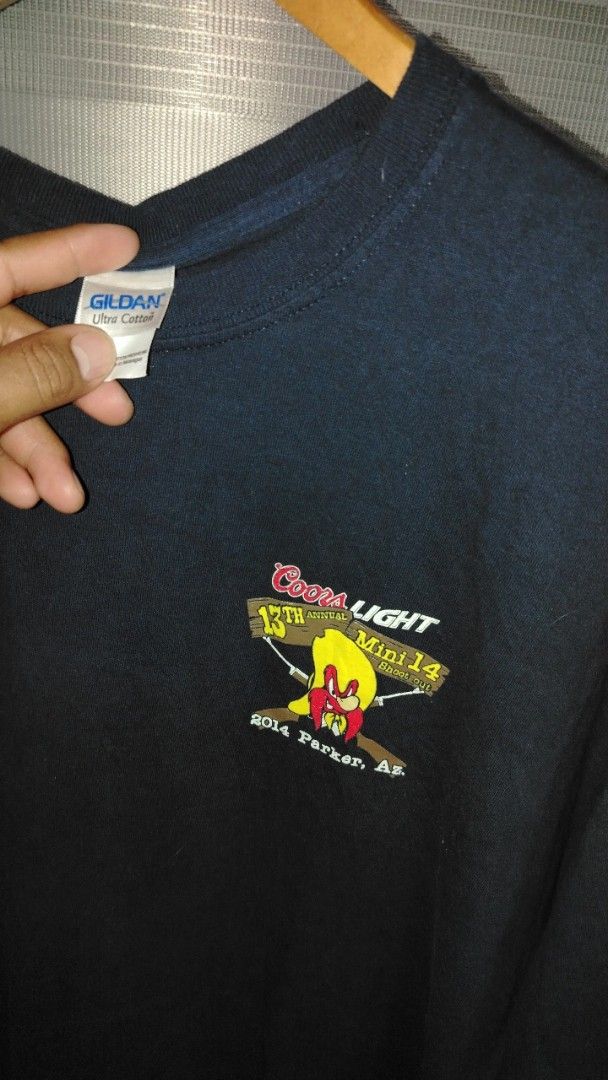 Coors Light Mini 14 Shoot Out 2014 T-Shirt (Category: Tshirts & Polo Shirts ) located in Cavite. Submitted by ukaynglahat (Listing ID 1444130511, Image 3). Description: - Black t-shirt from the 13th Annual Coors Light Mini 14 Shoot Out - Event held in Parker, AZ in 2014 - Features a fun graphic on the back with a cartoon character and firearms - Small embroidered logo on the front - Made by Gildan - Great for collectors or fans of the event.