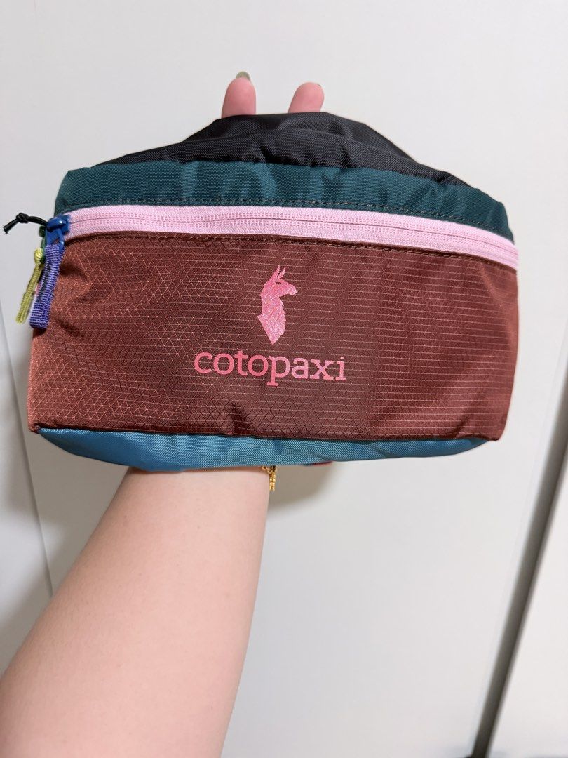 Cotopaxi Bataan Fanny Pack Belt Bag 3L (Category: Cross-body Bags) located in Singapore. Submitted by soxhz (Listing ID 1444252819, Image 1). Description: - Brand: Cotopaxi - Style: Multi-colored Fanny Pack - Features: Main zippered compartment, front zippered pocket - Strap: Adjustable with buckle closure - Use: Great for travel or everyday - Material: Durable - Design: Unique colorway.