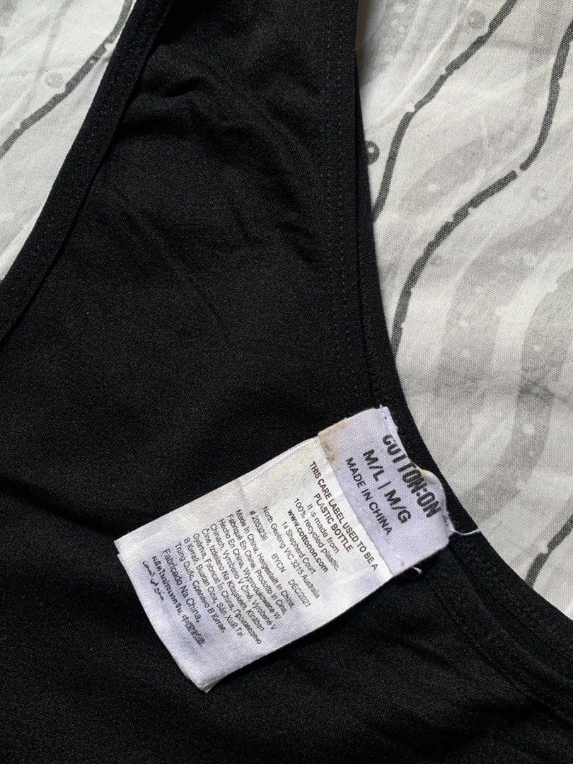 Cotton On Black One-Shoulder Crop Top (Category: Others Tops) located in Manila. Submitted by cthxrn (Listing ID 1444287755, Image 2). Description: Cotton On Black One-Shoulder Crop Top •Size: M/L (based on tag) •Color: Black •Excellent condition / Like new •Stretchy and comfortable fabric •Trendy one-shoulder asymmetrical design •No visible flaws on the top itself • Small washable mark on the tag •Perfect for casual wear, parties, or layering • 