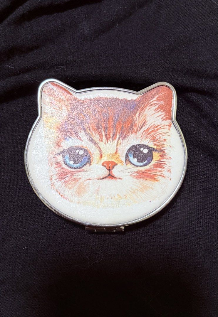 Cute Cat Face Compact Mirror ₱150 each (Category: Face Care) located in Manila. Submitted by yourtoothfairy (Listing ID 1444225083, Image 2). Description: - cat face folding compact mirror - Each mirror features a unique cat leatherette photo on the lid. - Compact and portable size, ideal for on-the-go touch-ups. - Silver interior mirror. - Makes a purr-fect accessory for any cat lover!😻.