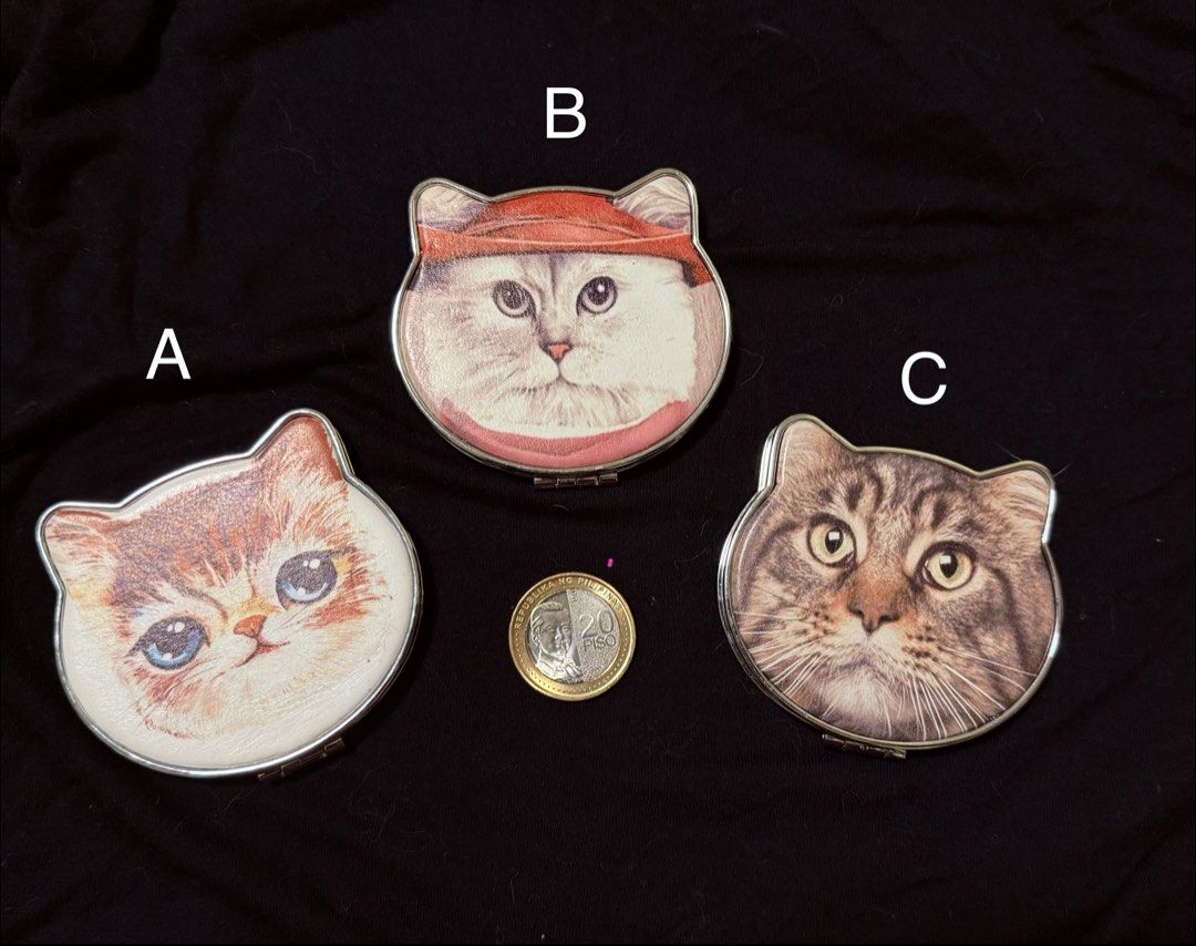 Cute Cat Face Compact Mirror ₱150 each (Category: Face Care) located in Manila. Submitted by yourtoothfairy (Listing ID 1444225083, Image 1). Description: - cat face folding compact mirror - Each mirror features a unique cat leatherette photo on the lid. - Compact and portable size, ideal for on-the-go touch-ups. - Silver interior mirror. - Makes a purr-fect accessory for any cat lover!😻.
