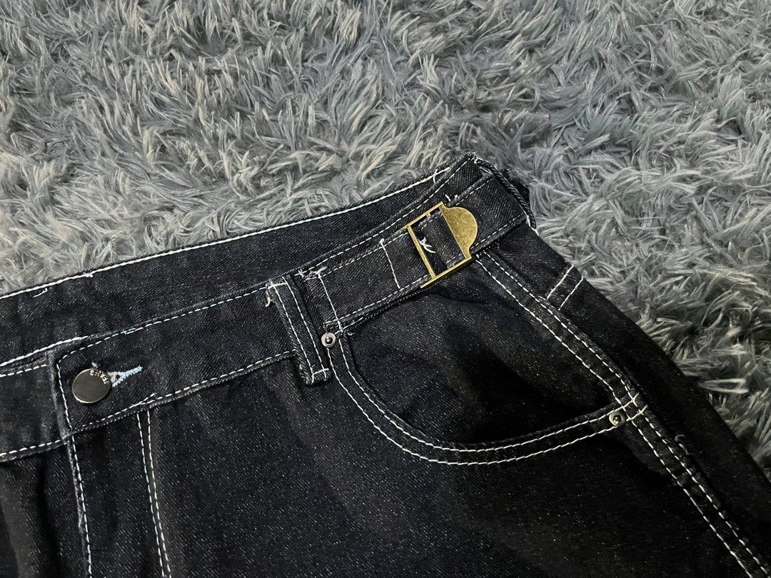 Dark Wash Denim Jeans with White Stitching (Category: Jeans) located in Caloocan City. Submitted by leo.noelalonzo (Listing ID 1444248964, Image 3). Description: - Dark wash denim jeans - Contrast white stitching throughout - Relaxed fit for everyday comfort - Two back pockets with embroidered logo detail - Elastic waistband for easy pull-on style - Ideal for casual outfits.