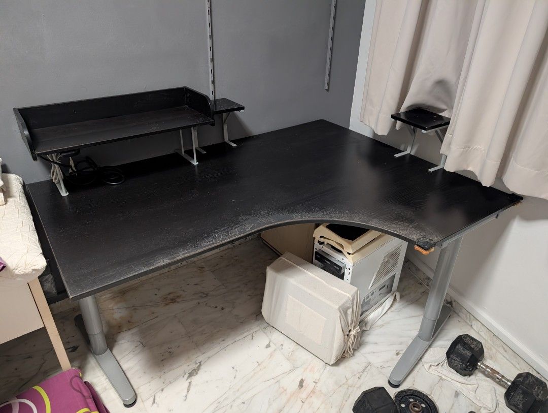 L-shape study table (Category: Tables & Sets) located in Singapore. Submitted by kyushuwhite (Listing ID 1444237389, Image 2). Description: Giving away my beloved L-shape table!!! Ideal for studying and wfh cuz you can work on one side of the table and "play" on another. The speaker stands you see were handmade by yours truly back in my younger days to achieve optimal hearing pleasure. Comes with extension plug glued to the bottom of the shelf to