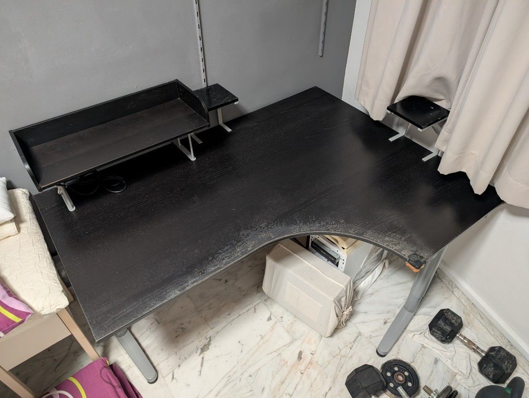 L-shape study table (Category: Tables & Sets) located in Singapore. Submitted by kyushuwhite (Listing ID 1444237389, Image 3). Description: Giving away my beloved L-shape table!!! Ideal for studying and wfh cuz you can work on one side of the table and "play" on another. The speaker stands you see were handmade by yours truly back in my younger days to achieve optimal hearing pleasure. Comes with extension plug glued to the bottom of the shelf to