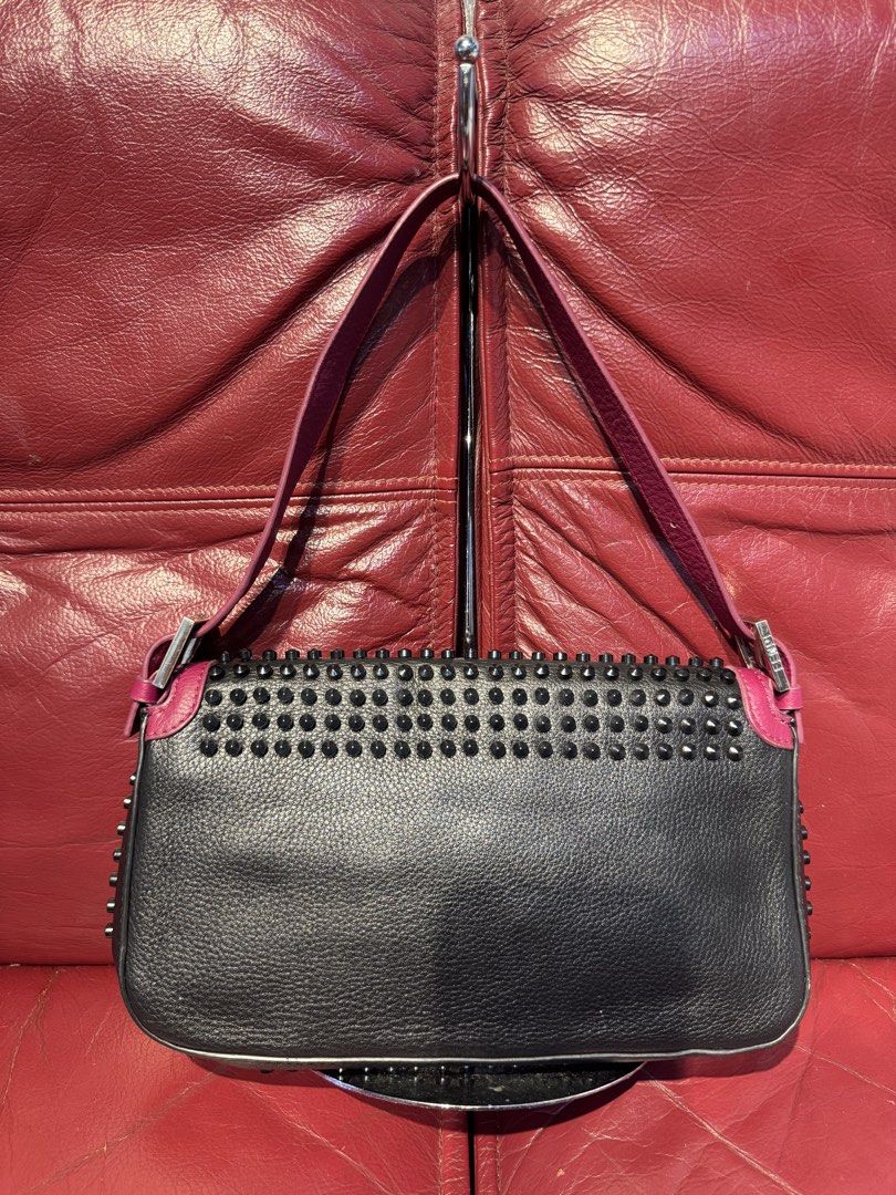 Fendi Black Studded Baguette Bag (Category: Luxury Bags & Wallets) located in Santiago. Submitted by twicebutnice03 (Listing ID 1444115612, Image 2). Description: - Classic Fendi Baguette style - Black leather with stud embellishments - Pink accents on strap and trim - Silver Fendi logo buckle closure - Versatile for day or night use Missing 2 stud From Japan Surplus.
