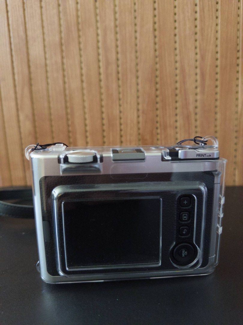 Fujifilm Instax Mini Evo Hybrid Instant Camera (Category: Cameras) located in Santa Rosa. Submitted by rsbellam (Listing ID 1444230411, Image 2). Description: Instax Mini Evo Included: - Camera Strap - Camera Case - Lens Cover - Screen Protector (Attached).