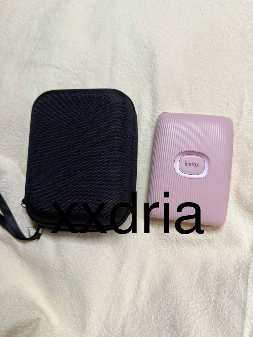 Fujifilm Instax Mini Link Printer with Case (negotiable) (Category: Cameras) located in Caloocan City. Submitted by xxdria01947 (Listing ID 1444118053, Image 2). Description: - Pink Fujifilm Instax Mini Link printer - Includes black protective case - Wirelessly prints photos directly from your smartphone - Compact and portable design - Ideal for capturing and sharing memories at parties and events.